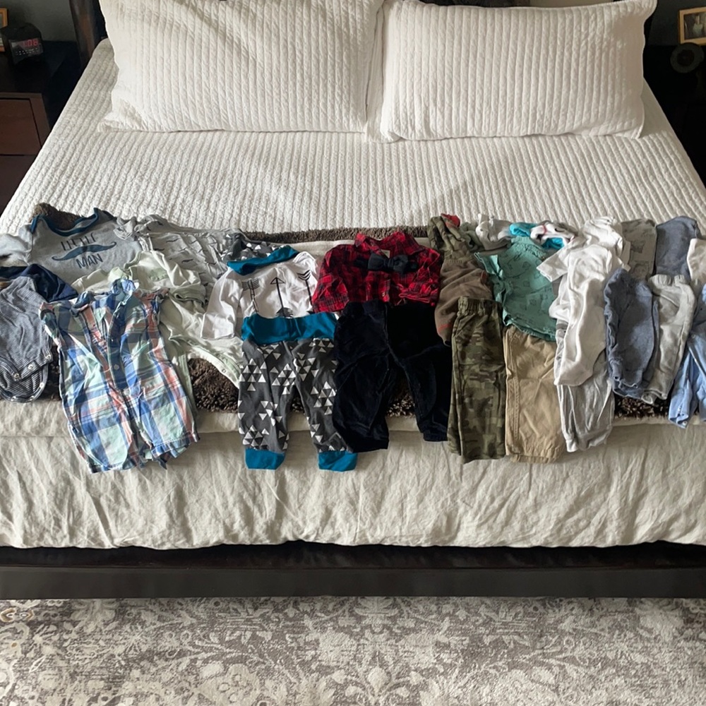 Lot of baby boy clothes.